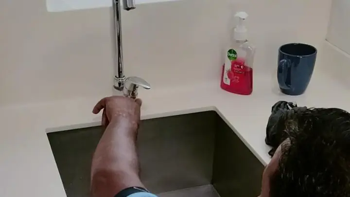 DJR plumber fitting a new kitchen sink tap